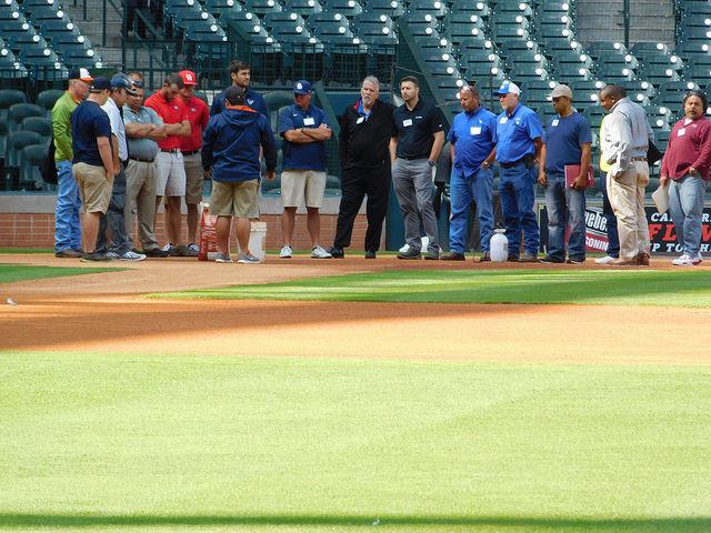 Members of the Houston Astros grounds crew discuss field maintenance processes and techniques with members of the Texas Sports Turf Managers Association. 