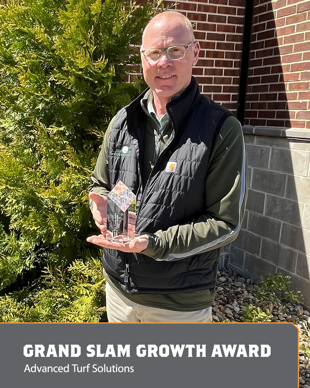 Image of a man holding an Ace Award.