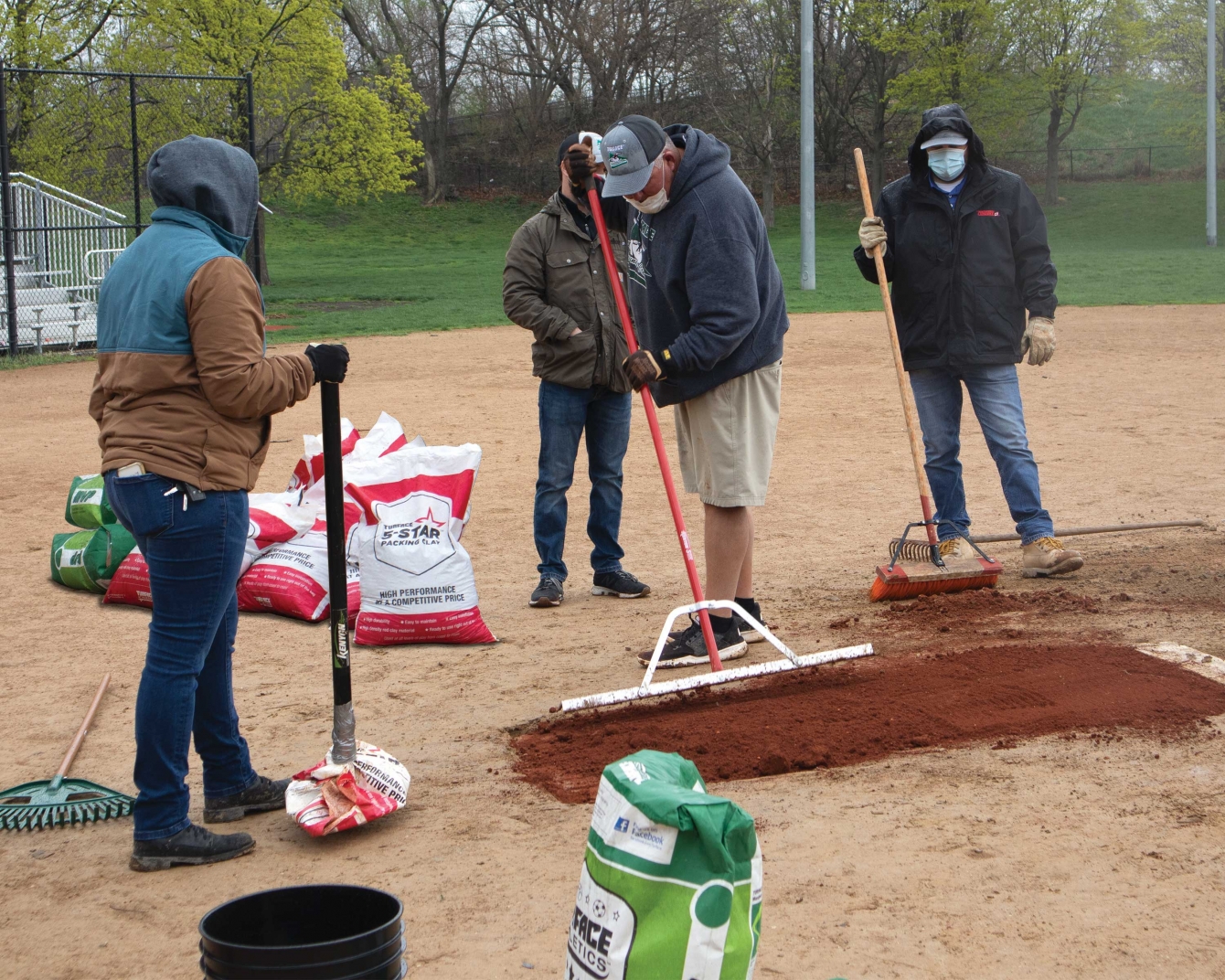 Essary demonstrates how to maintain the mound. 